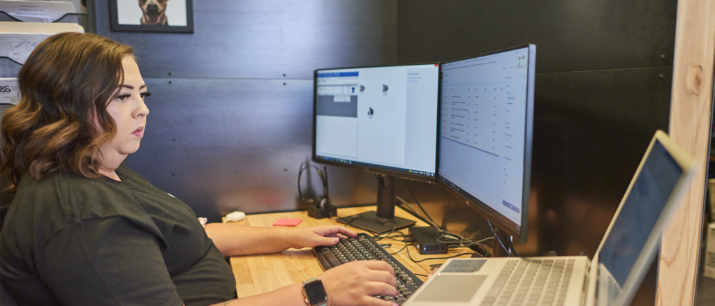 Shop employee working at computer